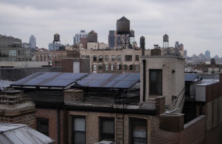 New York City brick rooftop solar array for an NY-Sun installer guide.