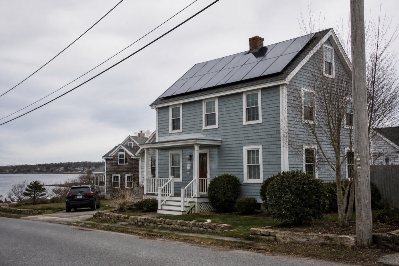 Rhode Island coastal house with rooftop solar for an installer permitting guide.